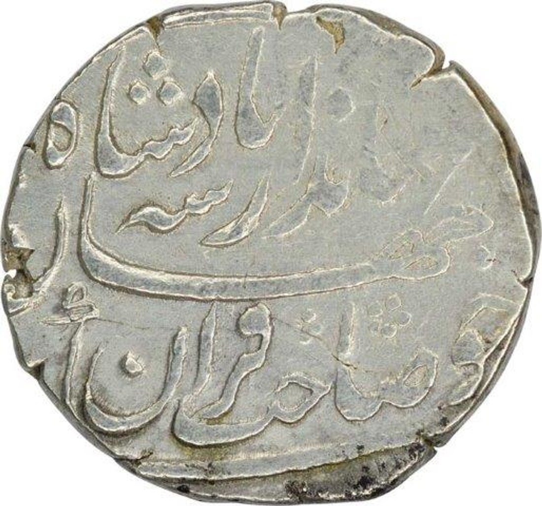 Silver One Rupee Coin of Jahandar Shah of Surat Mint.