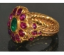 Ponderous Jadau Gold Ring brindled with phosphorescent Rubies and shimmering Emerald.
