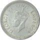 Silver One Quarter Rupee Coin of King George V of Calcutta Mint of 1943.