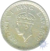 Silver Quarter Rupee of King George VI of Lahore Mint of 1945.