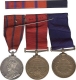 3 Medal bar     Victorian and King George Metropolitan Police medals with medal ribbon bar and service records.