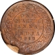 A Roll of 32 Bronze One Quarter Anna Coin of King George V of Calcutta Mint of 1919 in Brown Cover.